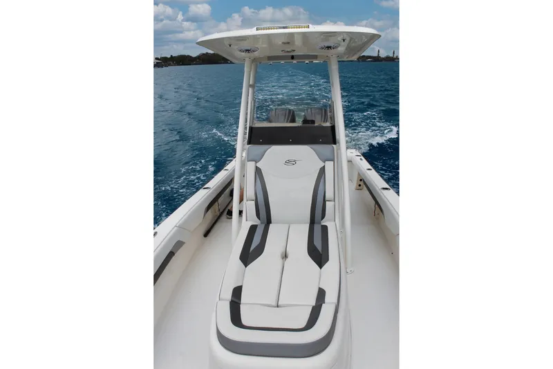 Slide: The Image of 2024 ShearWater 270 SS Open Carolina boat on open water, featuring sleek seating design. - 19