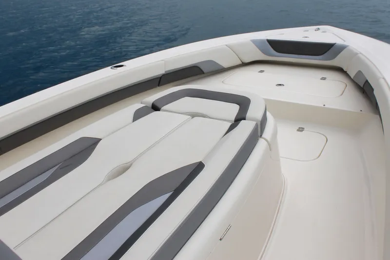 Slide: The Image of 2024 ShearWater 270 SS Open Carolina boat interior with cushioned seating and storage compartments. - 20