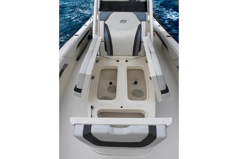 Slide: The Image of 2024 ShearWater 270 SS Open Carolina boat interior with seating and storage compartments. - 21