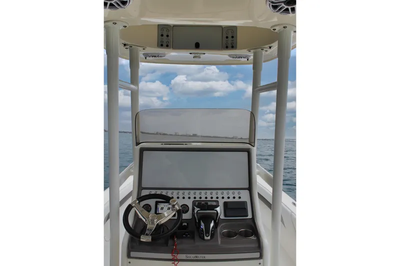 Slide: The Image of 2024 ShearWater 270 SS Open Carolina boat console with steering wheel and controls. - 22