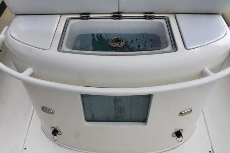 Slide: The Image of 2024 ShearWater 270 SS Open Carolina boat livewell with white finish and secure latches. - 25