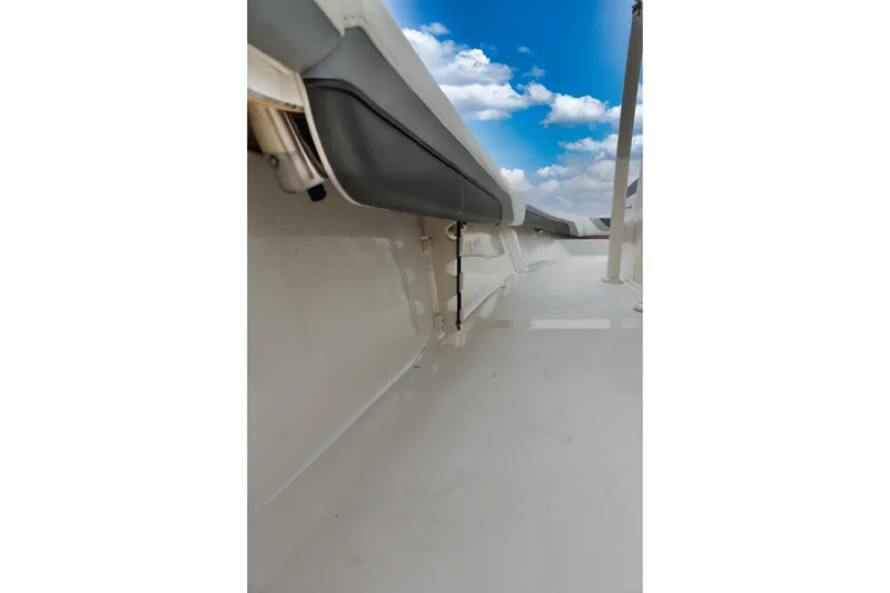 Slide: The Image of 2024 ShearWater 270 SS Open Carolina boat deck with clear blue sky. - 27
