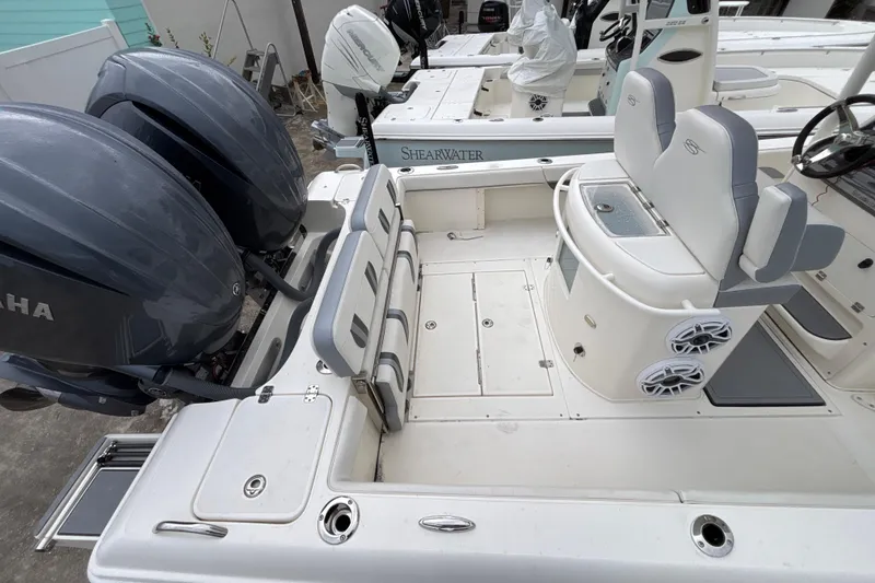 Slide: The Image of 2024 ShearWater 270 SS Open Carolina boat with dual Yamaha engines and spacious seating. - 3