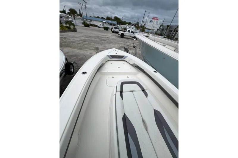 Slide: The Image of 2024 ShearWater 270 SS Open Carolina boat, showcasing sleek deck design and seating. - 5