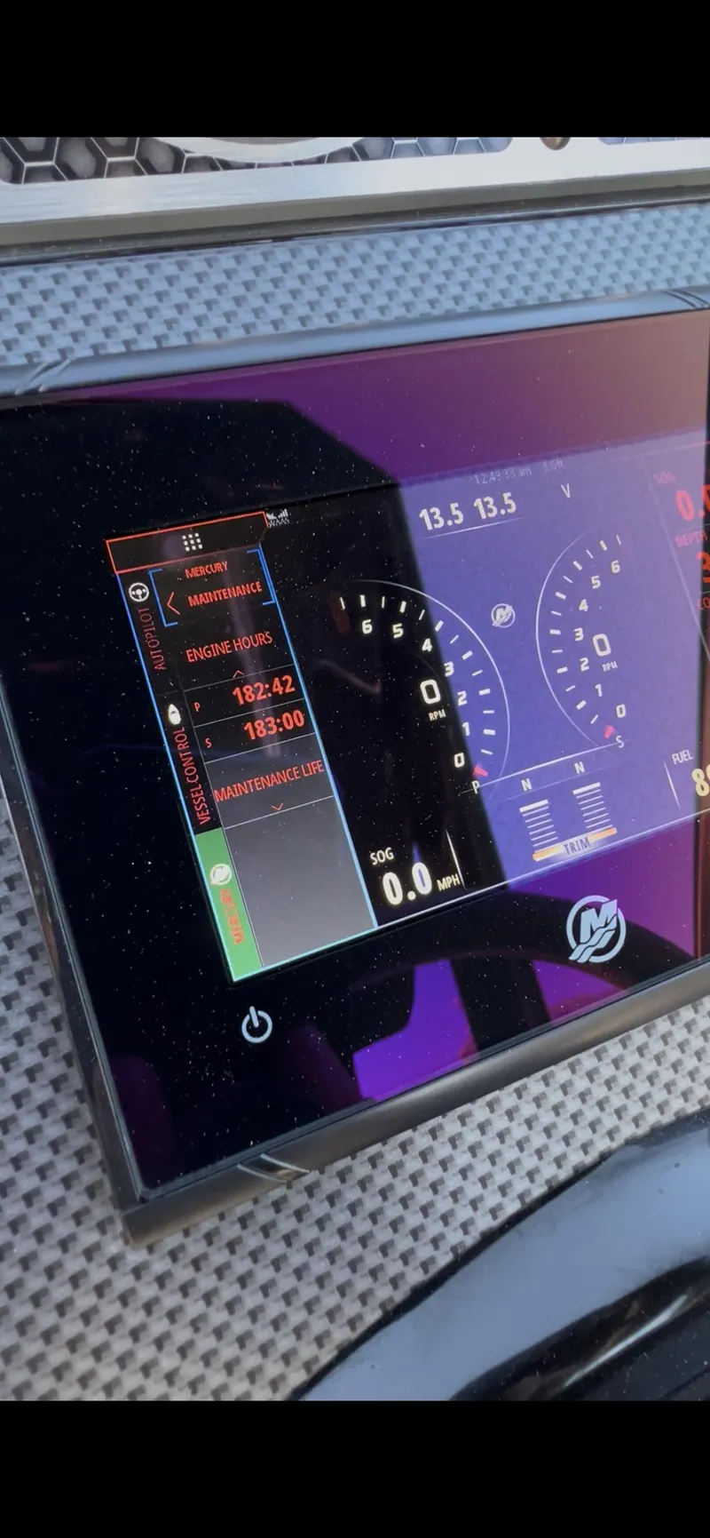 Slide: The Image of Dashboard display of a 2020 Cruisers Yachts 338OB, showing digital gauges and controls. - 20