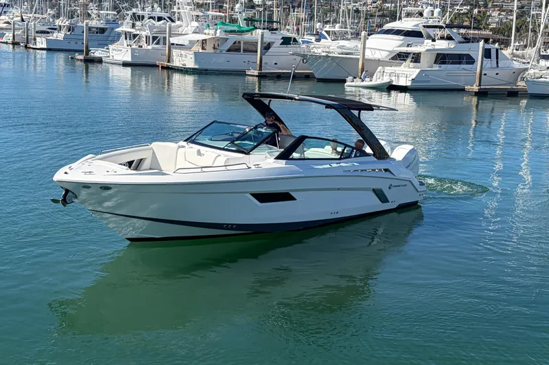 Slide: The Image of 2020 Cruisers Yachts 338 Outboard in marina, sleek design, calm waters, luxury boating. - 31