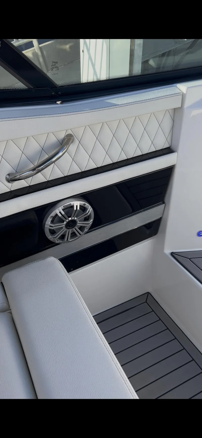 Slide: The Image of 2020 Cruisers Yachts 338OB interior with quilted paneling and speaker detail. - 10