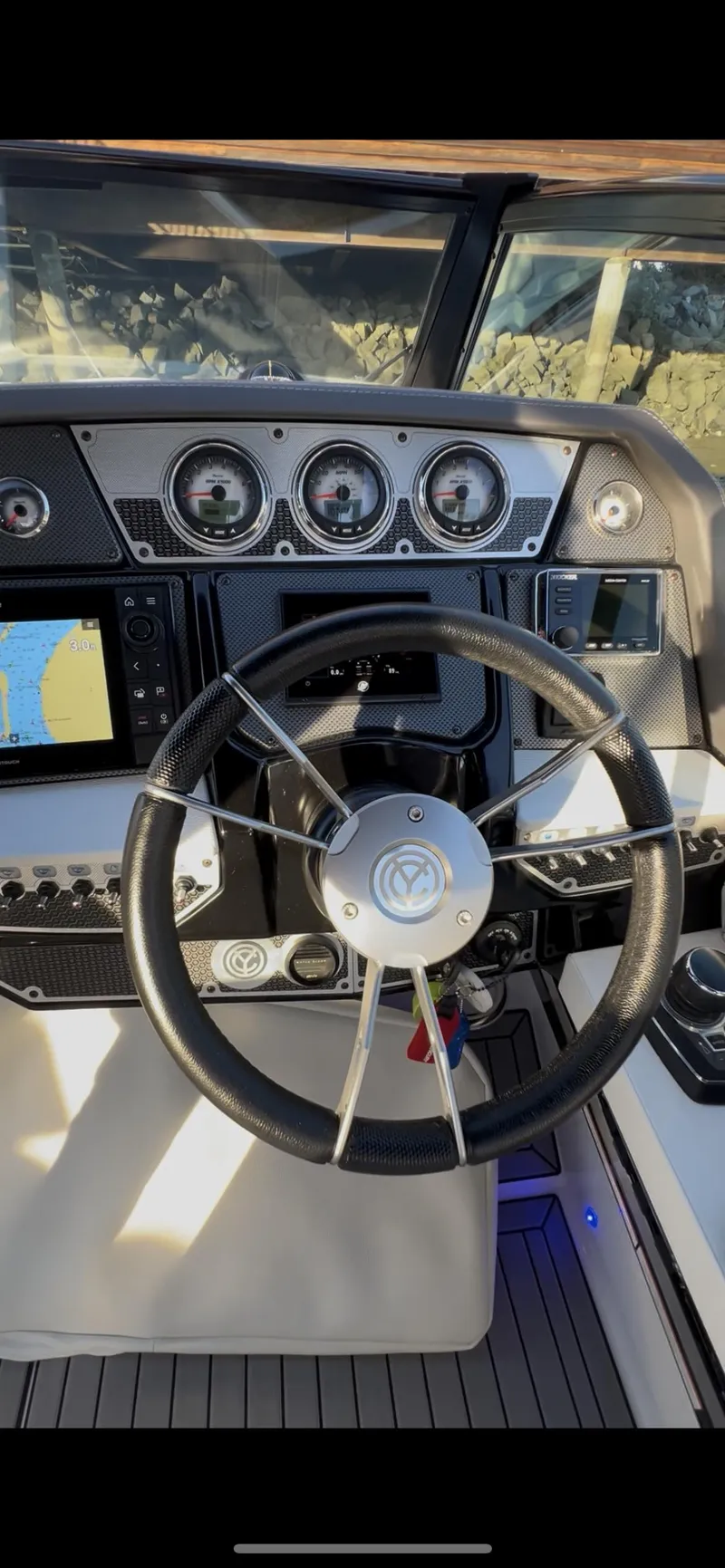 Slide: The Image of 2020 Cruisers Yachts 338OB helm with modern controls and navigation displays. - 18