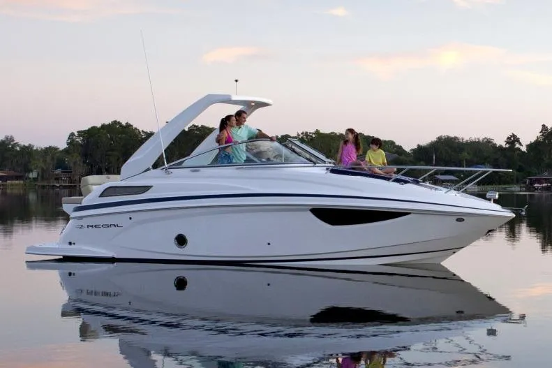 Slide: The Image of Manufacturer Provided Image: 2017 Regal 28 Express boat on calm water with people onboard. - 4