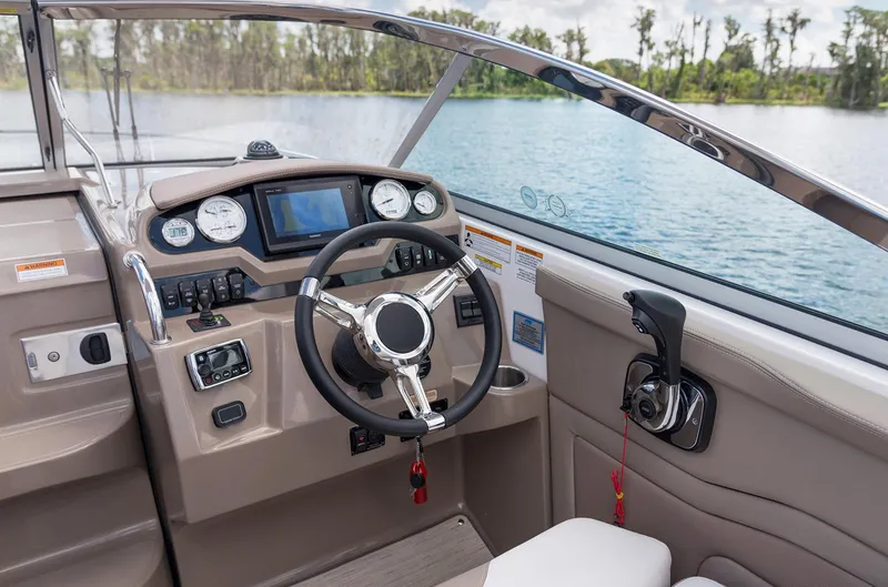 Slide: The Image of Manufacturer Provided Image: 2017 Regal 28 Express boat cockpit with steering wheel and control panel. - 5