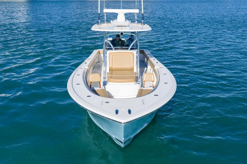 Slide: The Image of 2022 Valhalla Boatworks V-37 on calm blue water, front view. - 10