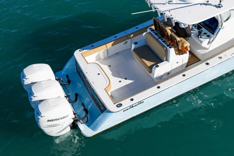 Slide: The Image of 2022 Valhalla Boatworks V-37 with triple Mercury engines on clear water. - 14