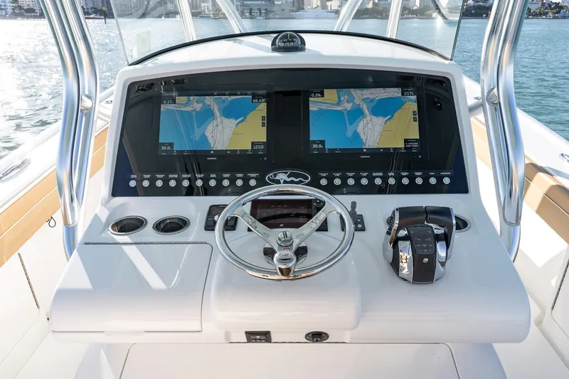 Slide: The Image of 2022 Valhalla Boatworks V-37 helm with dual navigation screens and steering wheel. - 15