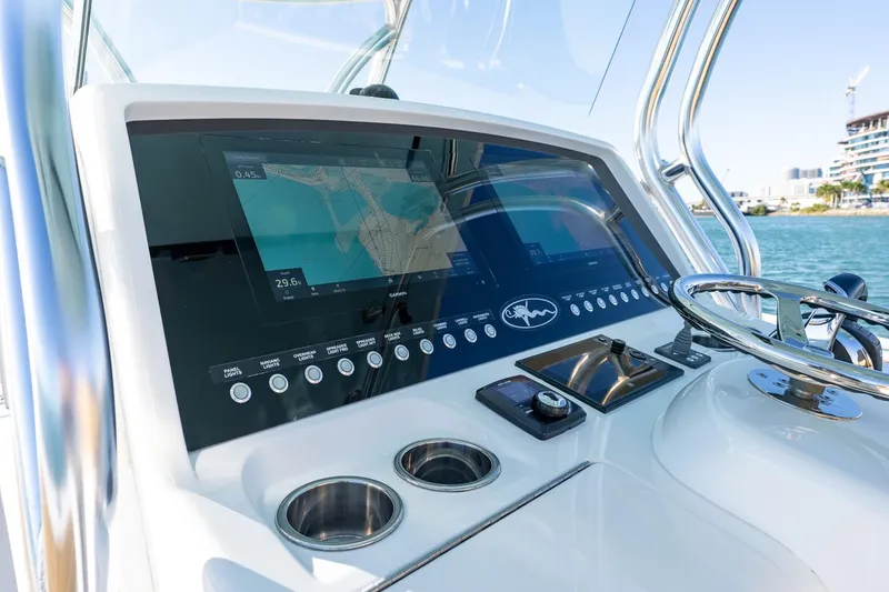 Slide: The Image of 2022 Valhalla Boatworks V-37 helm with advanced navigation displays and controls. - 17