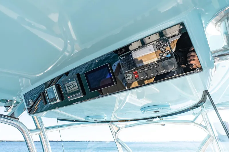 Slide: The Image of 2022 Valhalla Boatworks V-37 helm with advanced navigation and communication equipment. - 18