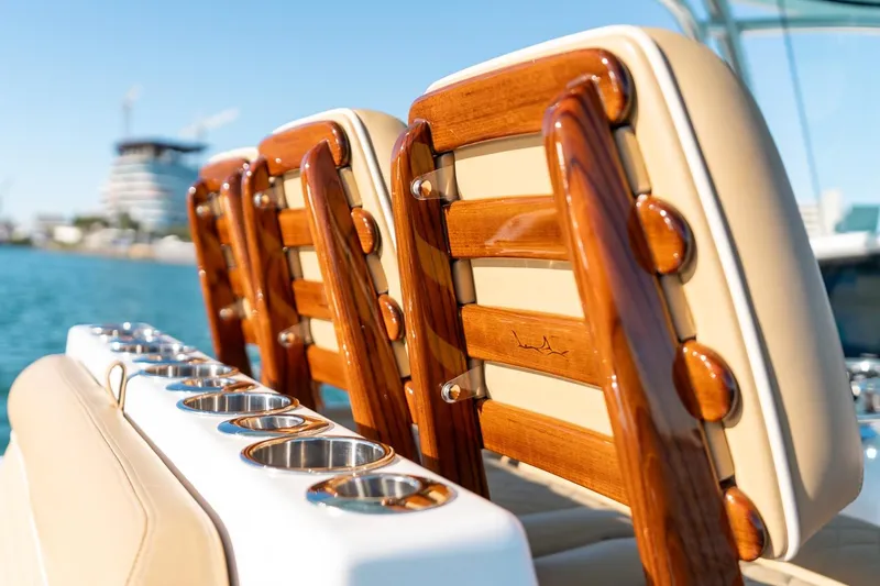 Slide: The Image of 2022 Valhalla Boatworks V-37 luxury seating with polished wood and cup holders. - 25