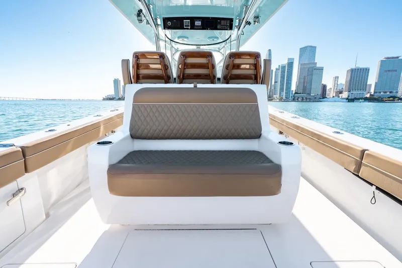 Slide: The Image of 2022 Valhalla Boatworks V-37 luxury seating with city skyline in background. - 26