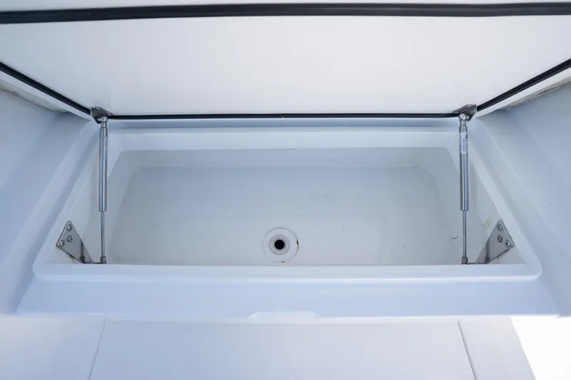 Slide: The Image of 2022 Valhalla Boatworks V-37 storage compartment with open lid and hydraulic supports. - 27
