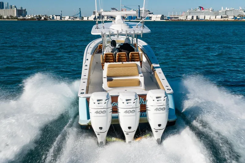 Slide: The Image of 2022 Valhalla Boatworks V-37 cruising with triple outboard engines in open water. - 3