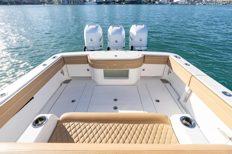 Slide: The Image of 2022 Valhalla Boatworks V-37 with triple engines, luxurious seating, and spacious deck on water. - 30