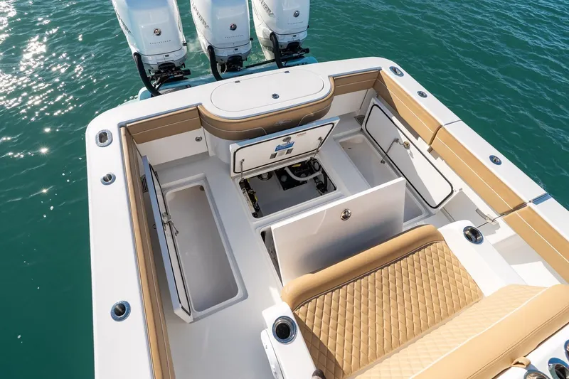 Slide: The Image of 2022 Valhalla Boatworks V-37 with open storage compartments and triple outboard engines. - 31