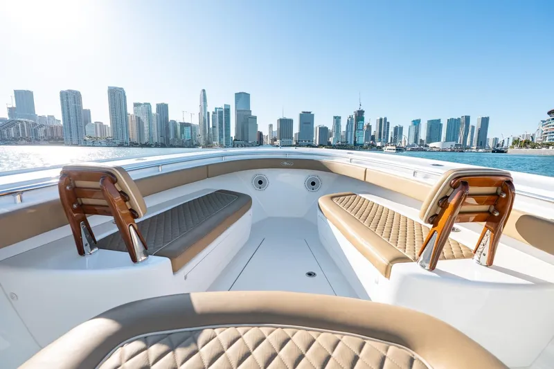 Slide: The Image of 2022 Valhalla Boatworks V-37 with city skyline in background, luxurious seating, sunny day. - 35