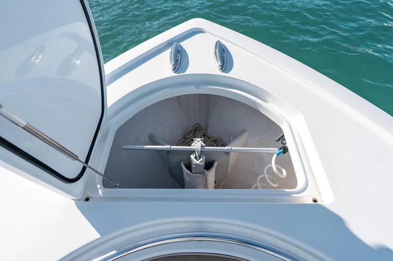 Slide: The Image of Anchor compartment of 2022 Valhalla Boatworks V-37, open on calm water. - 43