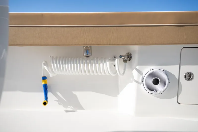 Slide: The Image of 2022 Valhalla Boatworks V-37 deck with coiled hose and speaker. - 44