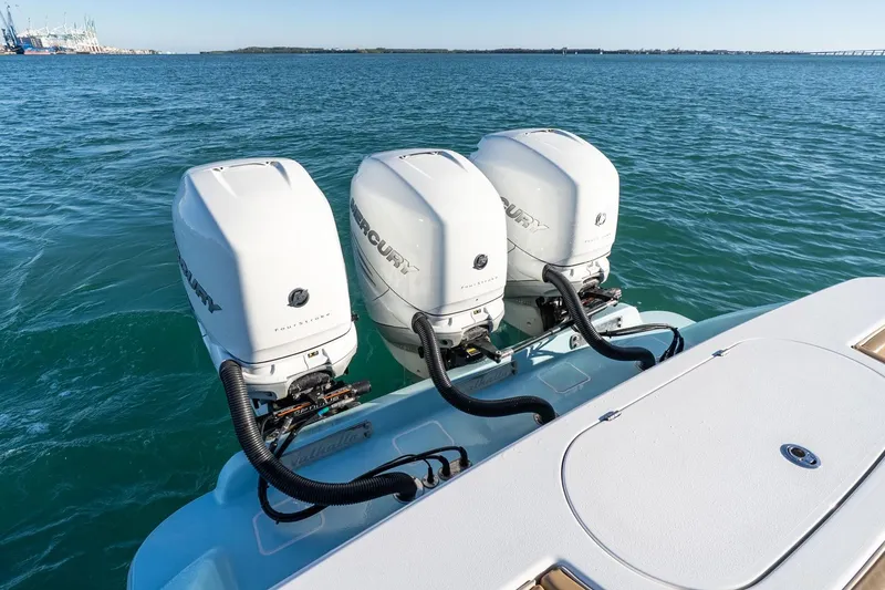 Slide: The Image of 2022 Valhalla Boatworks V-37 with triple Mercury outboard engines on open water. - 45