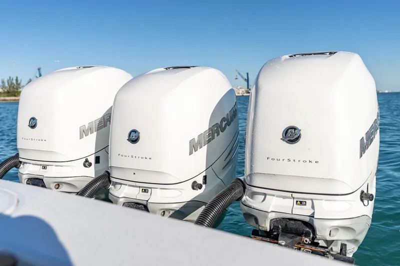 Slide: The Image of Triple Mercury FourStroke engines on 2022 Valhalla Boatworks V-37 in open water. - 47