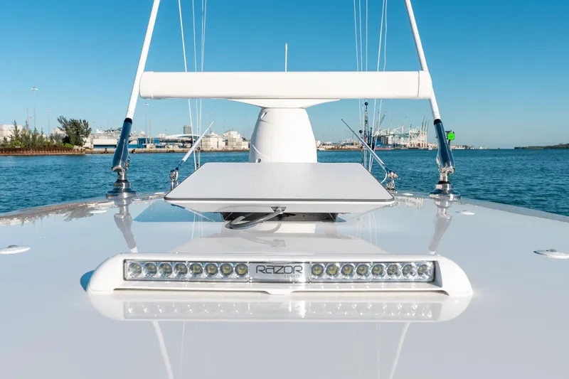 Slide: The Image of 2022 Valhalla Boatworks V-37 bow with LED lights, docked in a marina. - 48