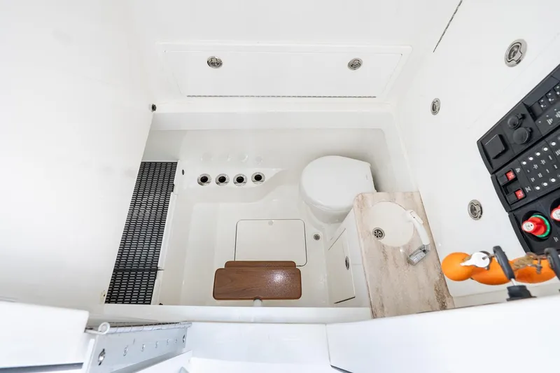 Slide: The Image of 2022 Valhalla Boatworks V-37 interior with compact bathroom and control panel. - 49