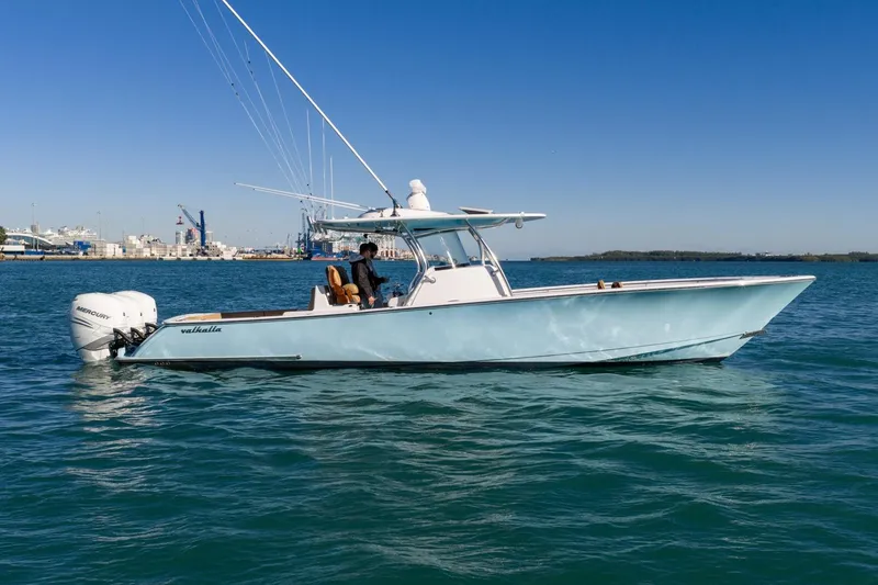 Slide: The Image of 2022 Valhalla Boatworks V-37 on water, side view with clear blue sky. - 5