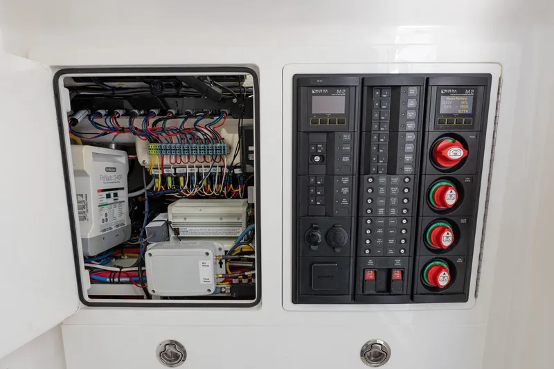Slide: The Image of Electrical panel of 2022 Valhalla Boatworks V-37, showcasing wiring and control systems. - 51