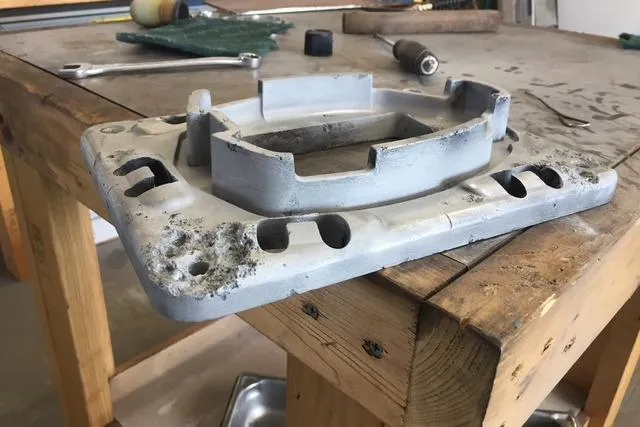 Slide: The Image of Damaged metal component on workbench, possibly from a 1988 Caliber 38 model. - 15