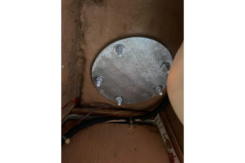 Slide: The Image of Metallic circular plate with bolts in a wooden enclosure, Caliber 38, 1988. - 17