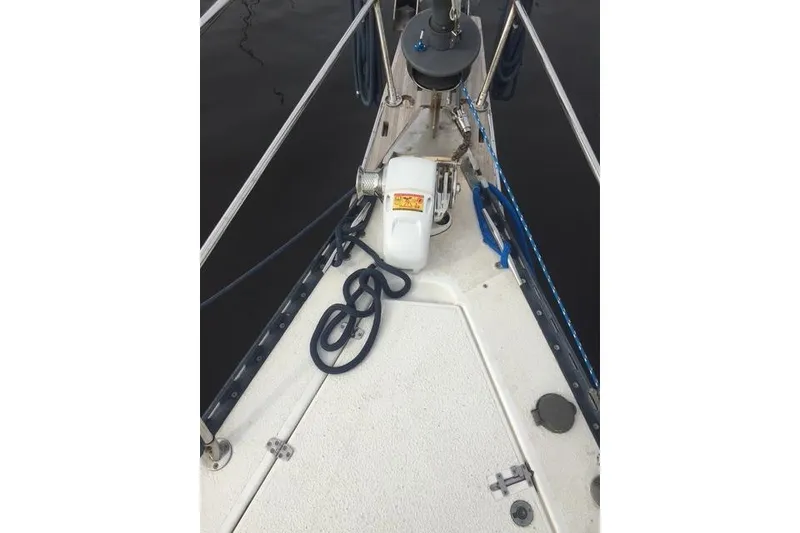 Slide: The Image of Bow of 1988 Caliber 38 sailboat with anchor and coiled ropes. - 9