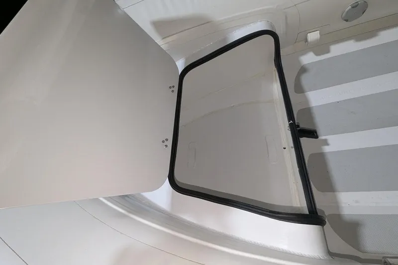 Slide: The Image of Open storage compartment in 2025 Zodiac Nomad 3.3 RIB Alu boat. - 4