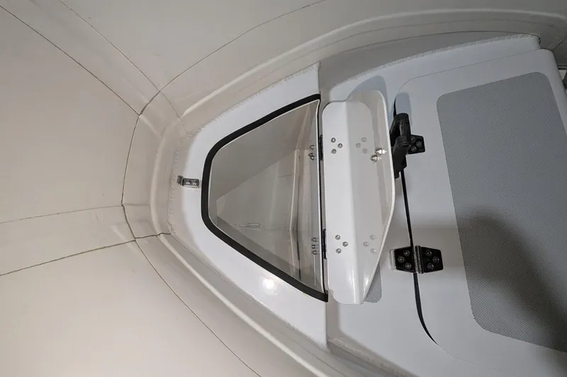 Slide: The Image of 2025 Zodiac Nomad 3.3 RIB Alu interior detail, featuring hatch and seating area. - 5