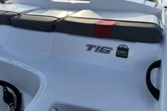 Slide: The Image of 2023 Tahoe T16 boat with cushioned seating and sleek design. - 10