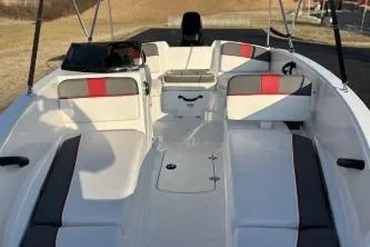 Slide: The Image of 2023 Tahoe T16 boat interior with white and red seating, spacious layout. - 4