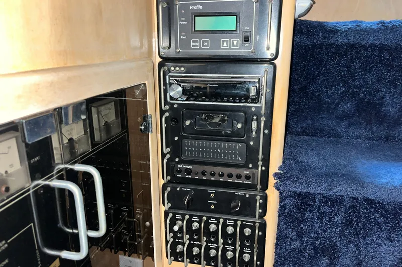 Slide: The Image of Control panel of a 1995 Carver 325 Aft Cabin Motor Yacht with electronic equipment. - 19