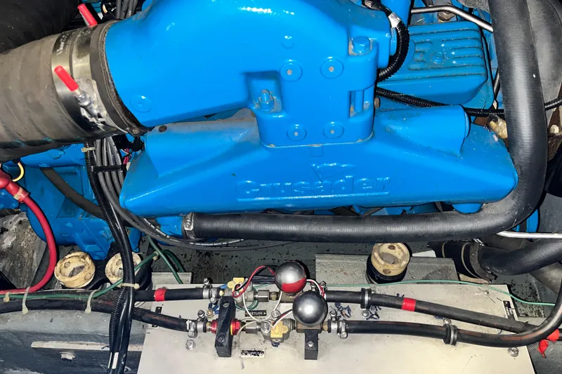 Slide: The Image of Engine of 1995 Carver 325 Aft Cabin Motor Yacht, featuring blue Crusader components. - 23