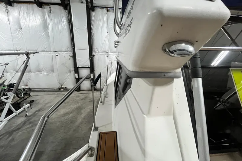 Slide: The Image of 1995 Carver 325 Aft Cabin Motor Yacht in storage, showcasing exterior details. - 4