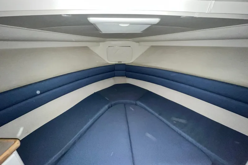 Slide: The Image of Interior cabin of 1995 Carver 325 Aft Cabin Motor Yacht with blue seating. - 17