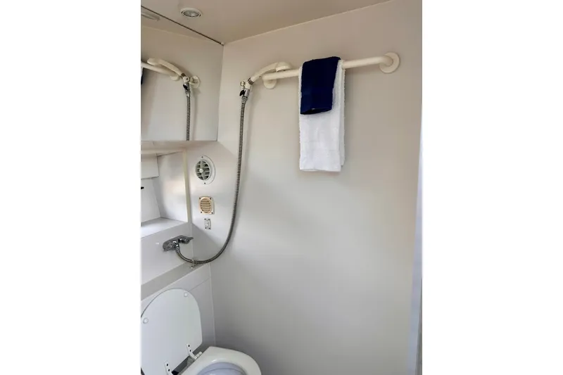 Slide: The Image of Bathroom interior of 1995 Carver 325 Aft Cabin Motor Yacht with shower and towels. - 6