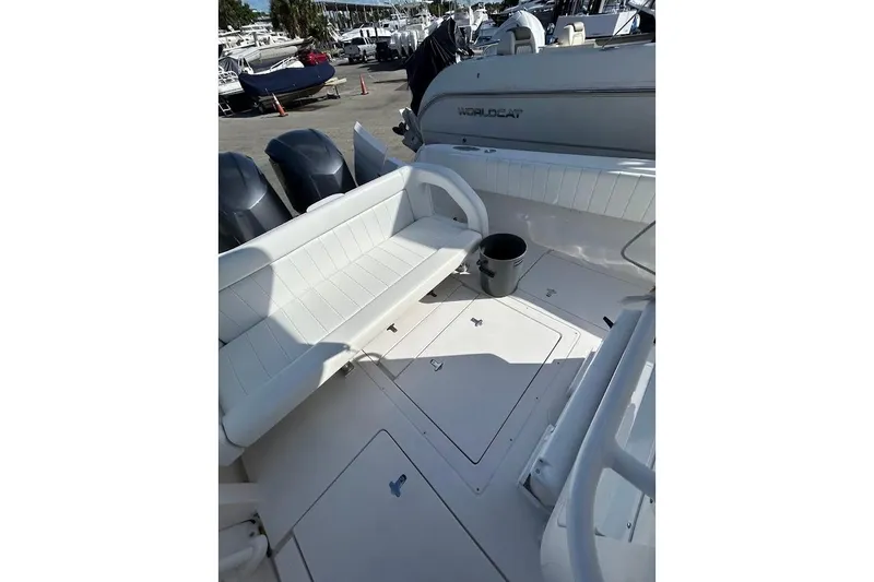 Slide: The Image of 2014 Intrepid 327 Center Console boat interior with seating and outboard motors. - 13