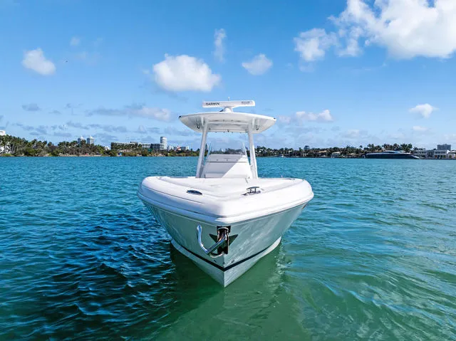 Slide: The Image of 2014 Intrepid 327 Center Console boat interior with speakers and electrical connections. - 21