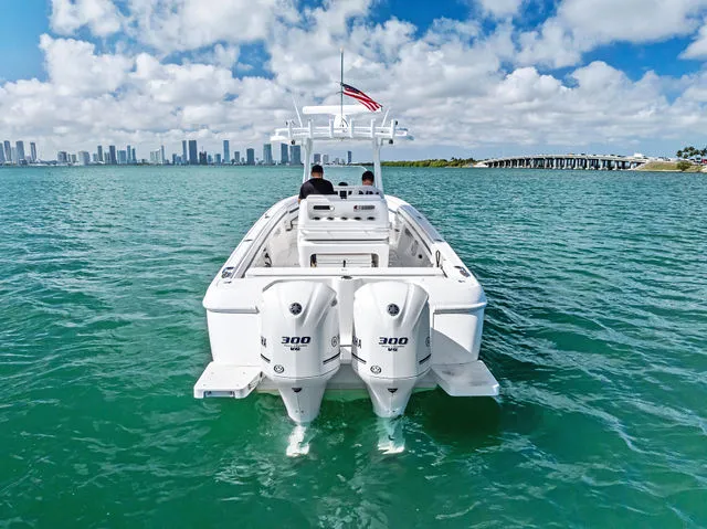 Slide: The Image of 2014 Intrepid 327 Center Console boat dashboard with Garmin navigation system. - 25