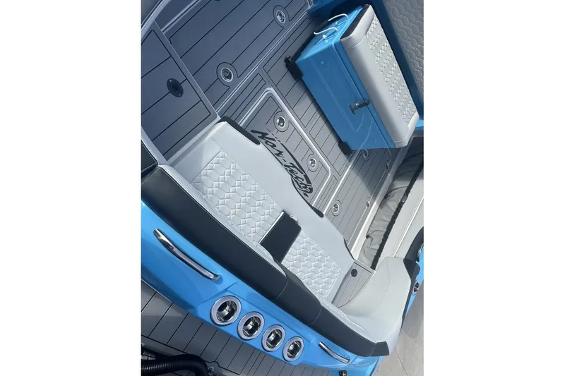 Slide: The Image of 2025 Nor-Tech 340 Sport Center Console interior with stylish seating and modern design. - 16